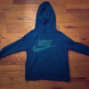 A teal Nike sweatshirt